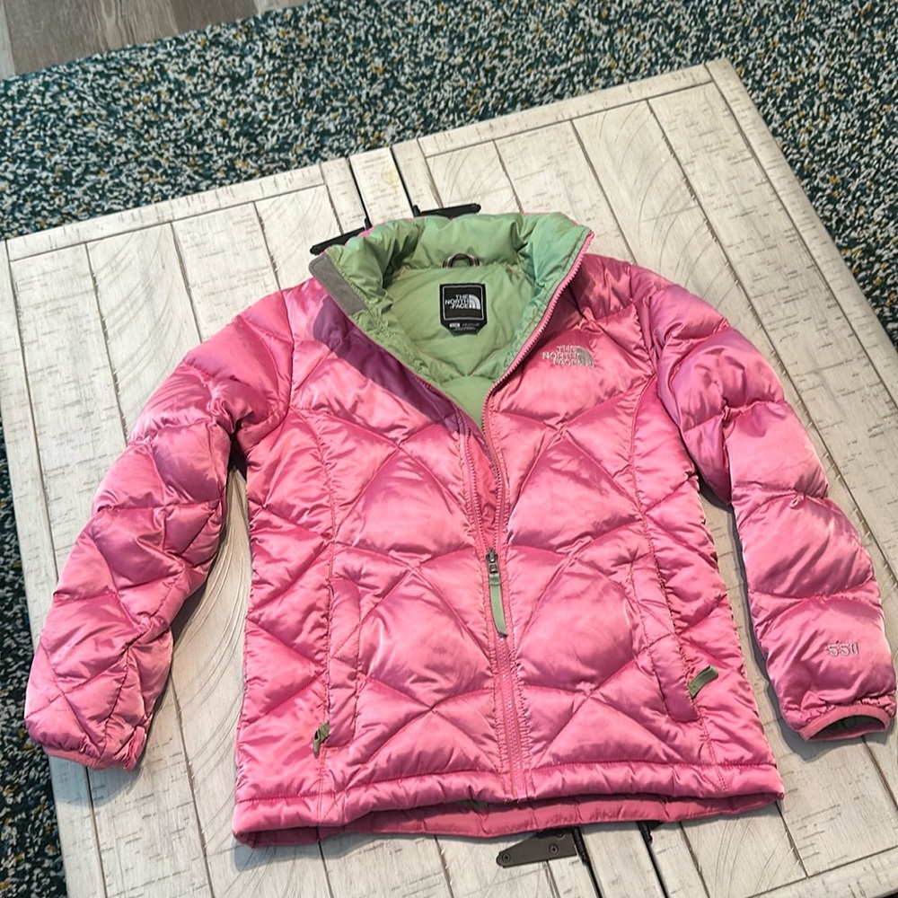 North Face girls puffer jacket size large shiney pink with green on the inside